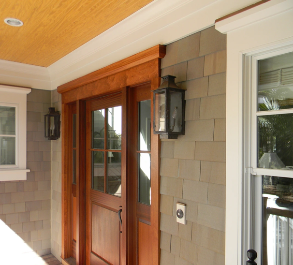 Copper Aspen Lantern showcased on an outdoor doorframe with a dark patina coating