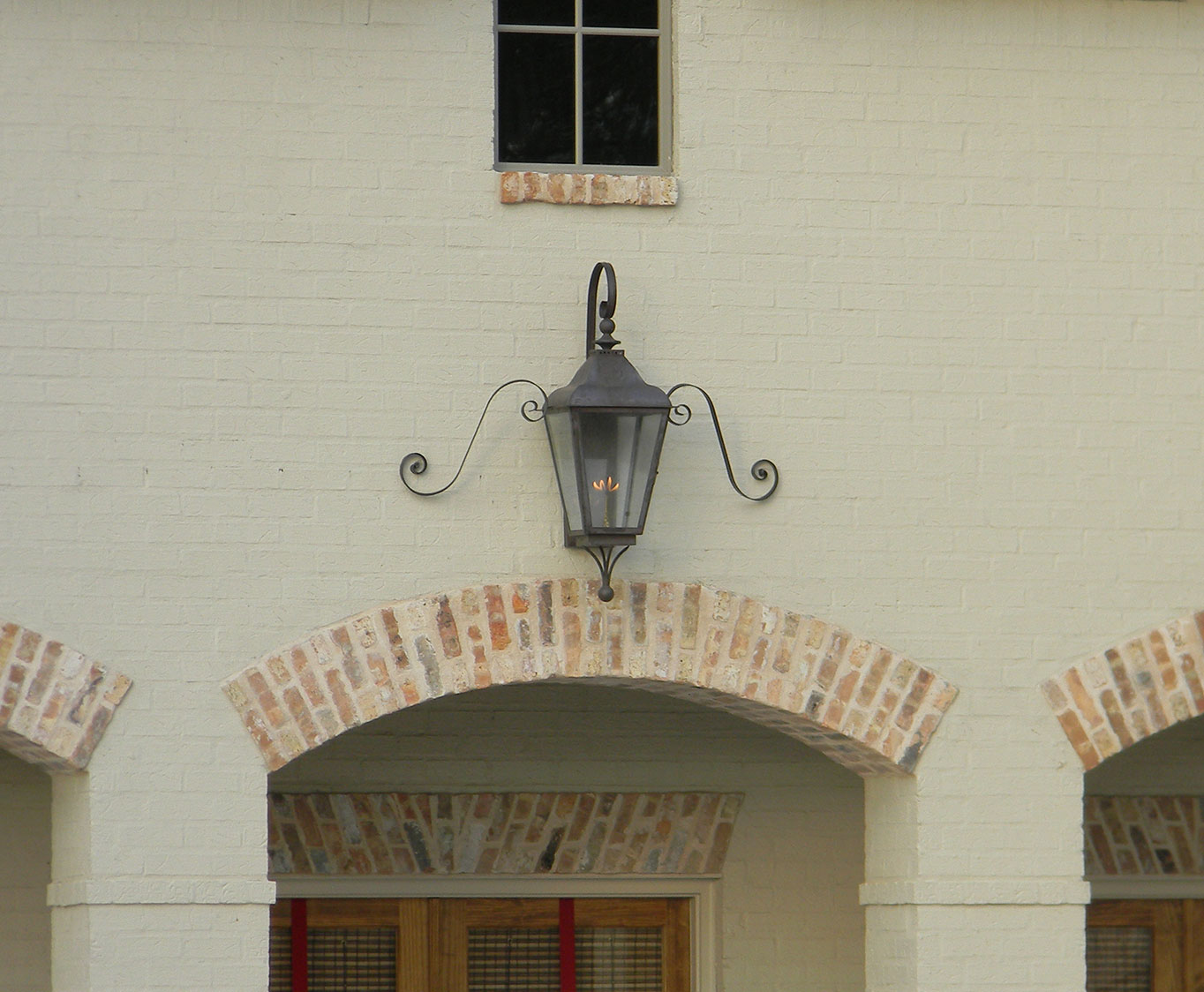 An example of a mustache curl on a wall lantern