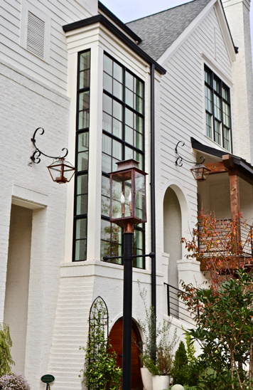 Copper Aspen lantern showcased on a steel post mount outside