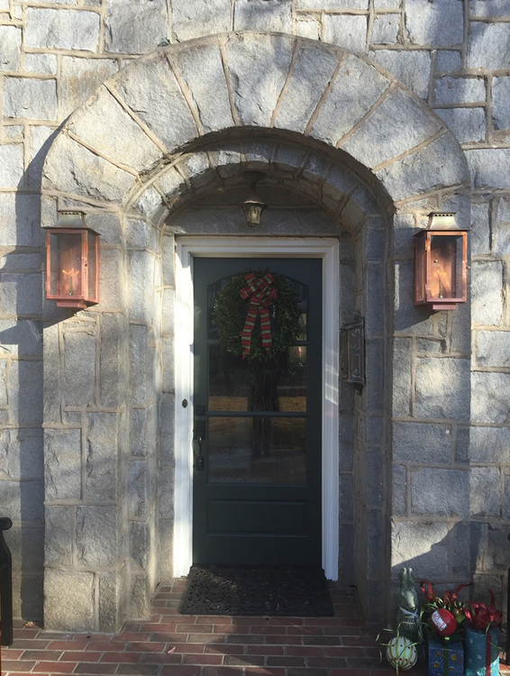 Copper Aspen lantern featured on stone doorway outside