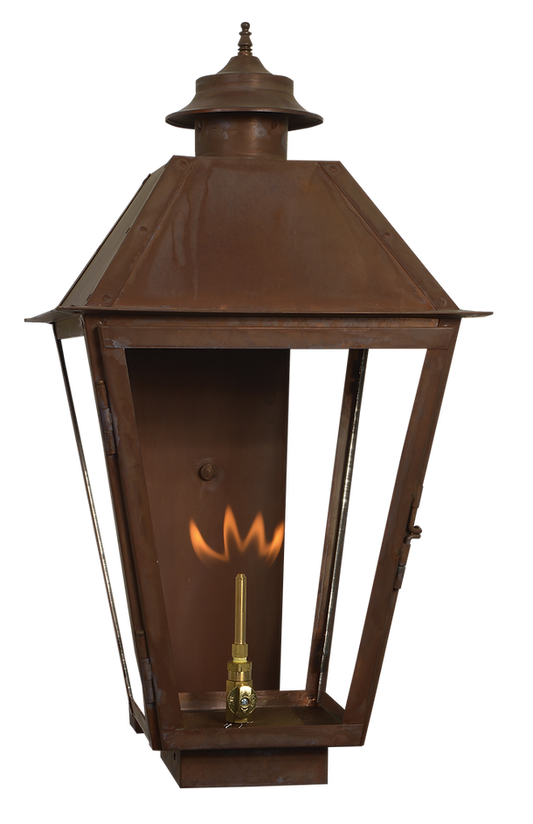 A copper Magnolia wall mount lantern with a gas lighting feature