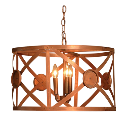 A copper XDrum chandelier is featured with criss crossing elements and a triple candelabra